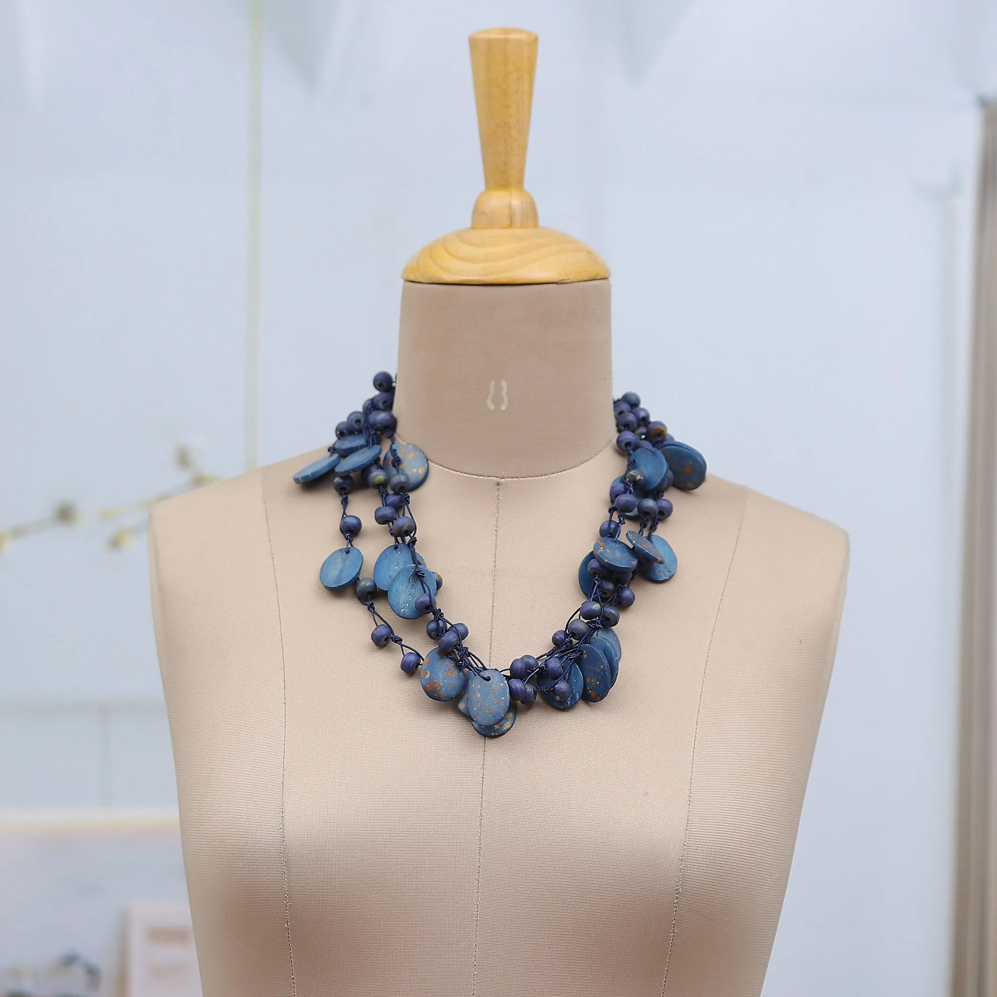 Hand-Carved Beaded Statement Necklace in Blue and Gold Hues - Bohemian Joy in Blue | NOVICA