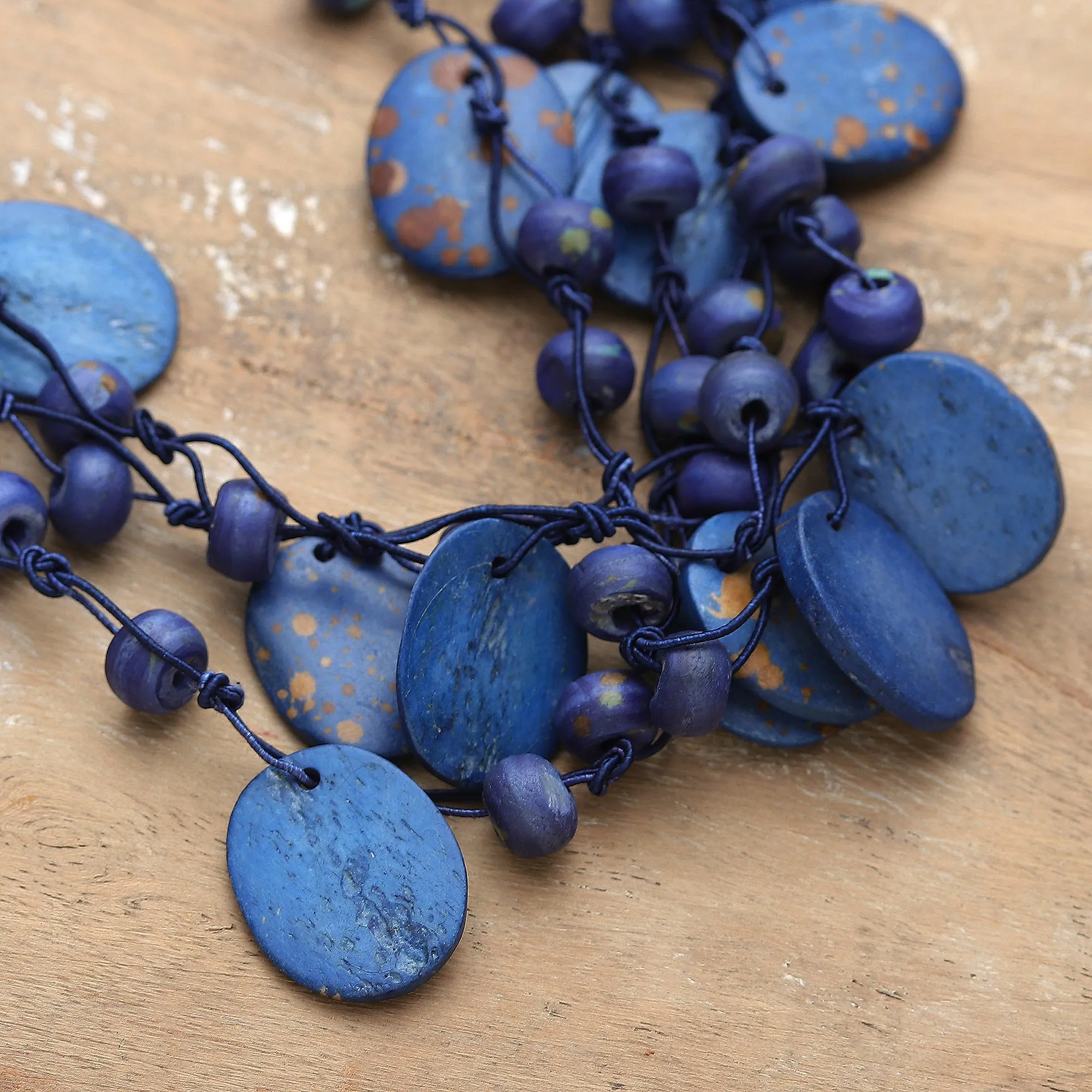 Hand-Carved Beaded Statement Necklace in Blue and Gold Hues - Bohemian Joy in Blue | NOVICA