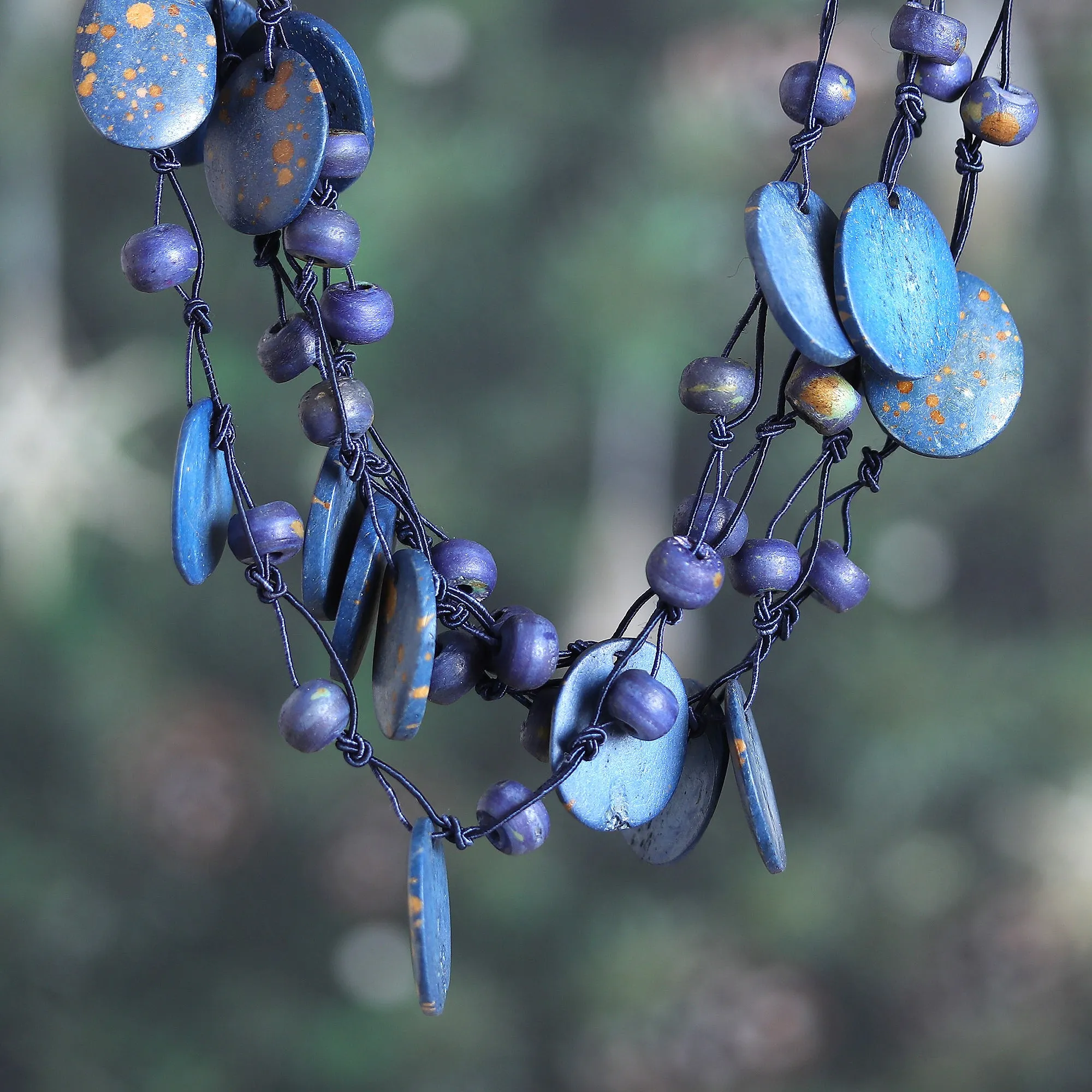 Hand-Carved Beaded Statement Necklace in Blue and Gold Hues - Bohemian Joy in Blue | NOVICA
